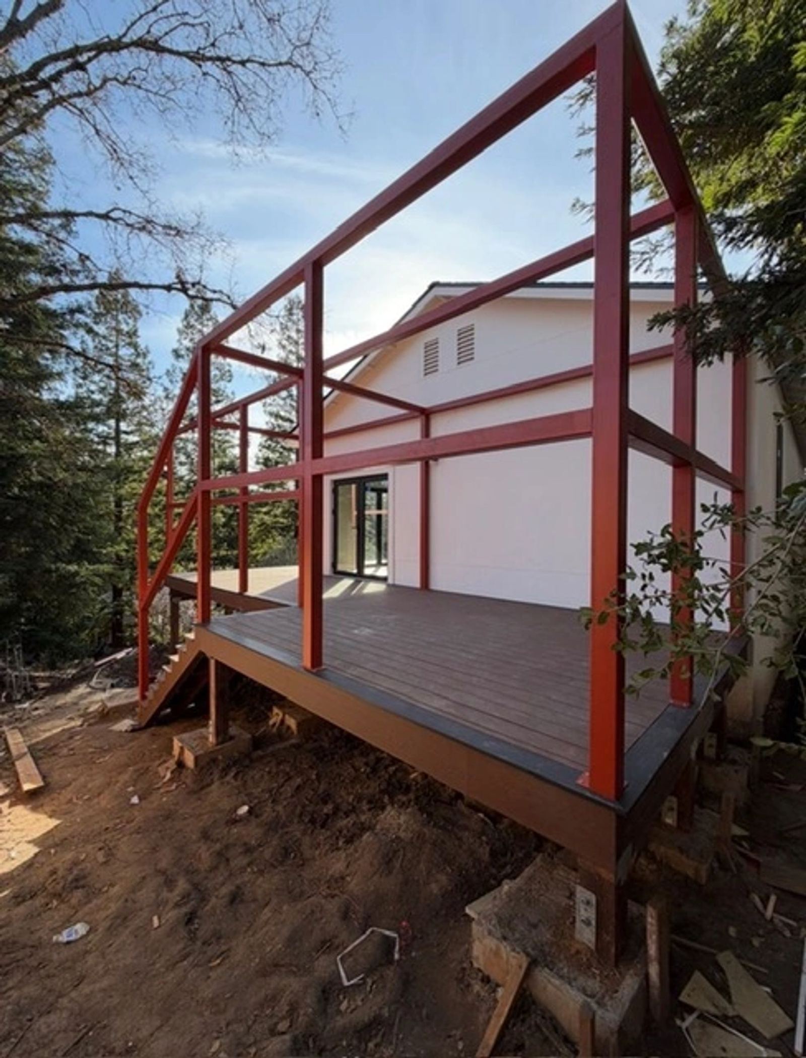 A red structural steel deck frame under construction